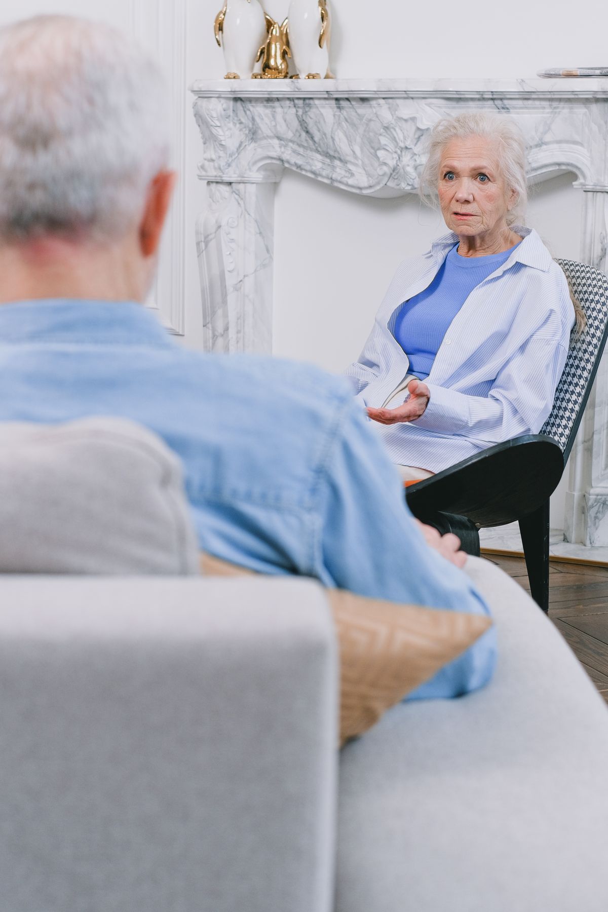 Older woman speaking with someone in a calm home setting